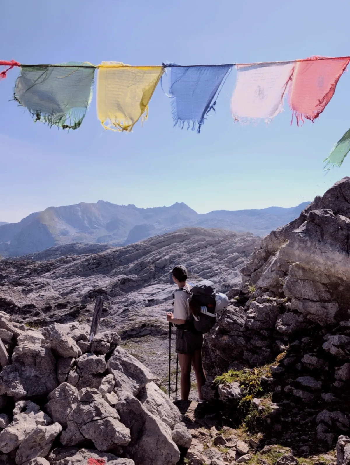 Prayer flags above a rocky mountain path in the Steinernes Meer photographed with the Steine film look